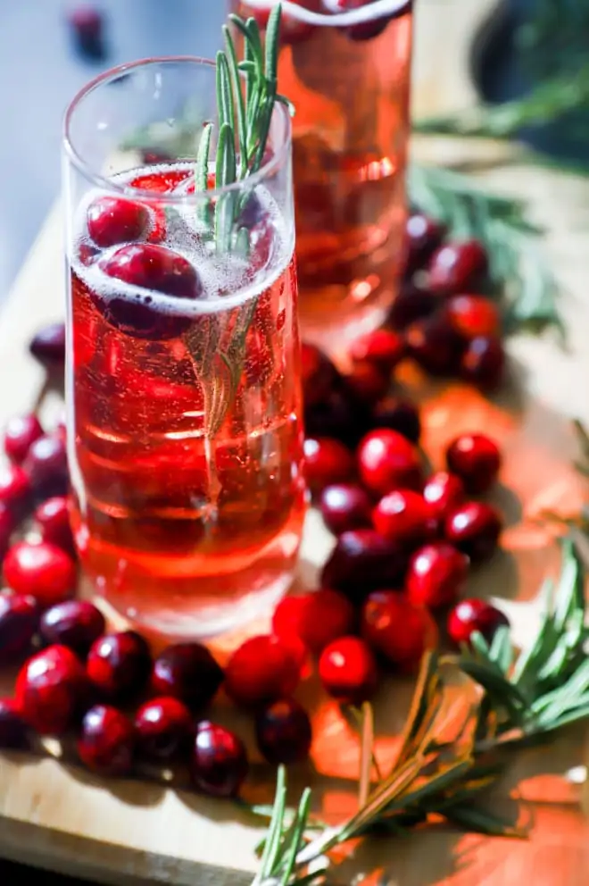 Rosemary and cranberry cocktail in cocktail glasses