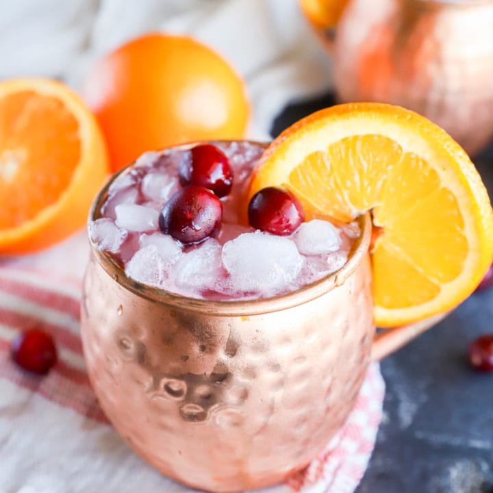 Copper mugs with cranberry moscow mule with orange