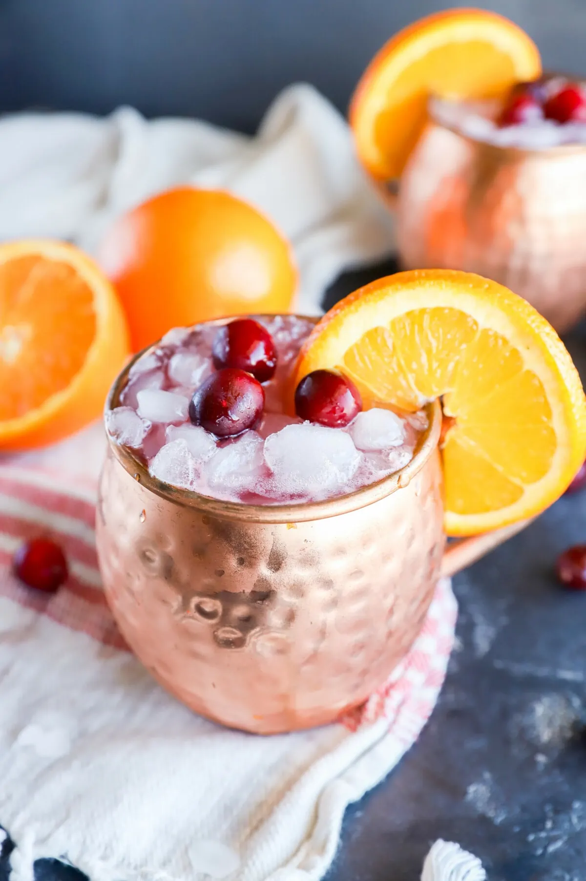 Copper mugs with cranberry moscow mule with orange