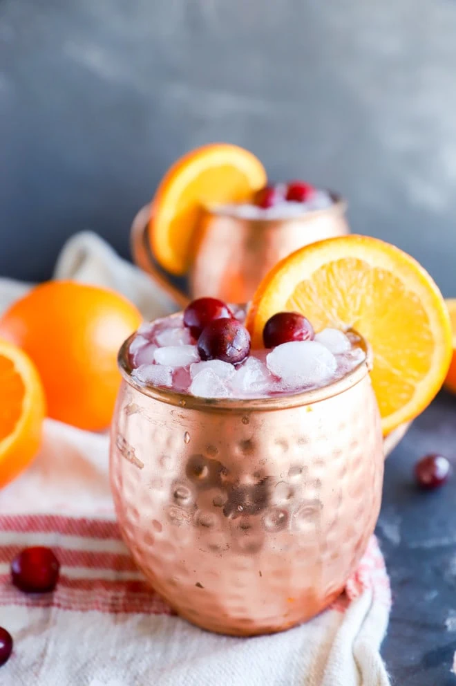 Side photo of cranberry orange cocktail in mugs