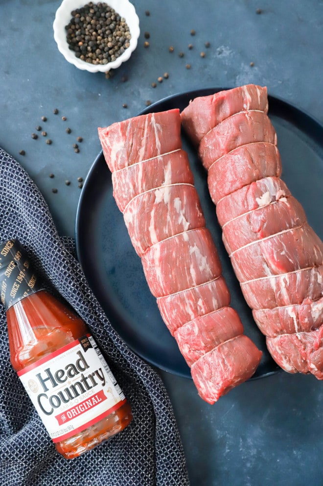 overhead image of beef tenderloin and bbq sauce