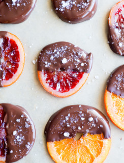 Image of chocolate dipped orange slices on parchment