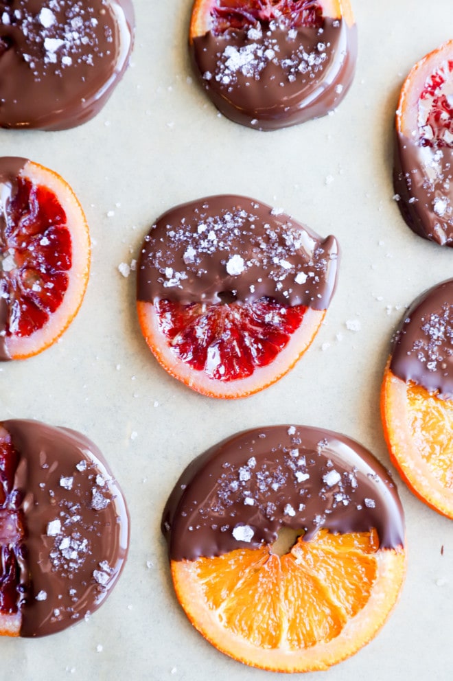 Image of chocolate dipped orange slices on parchment