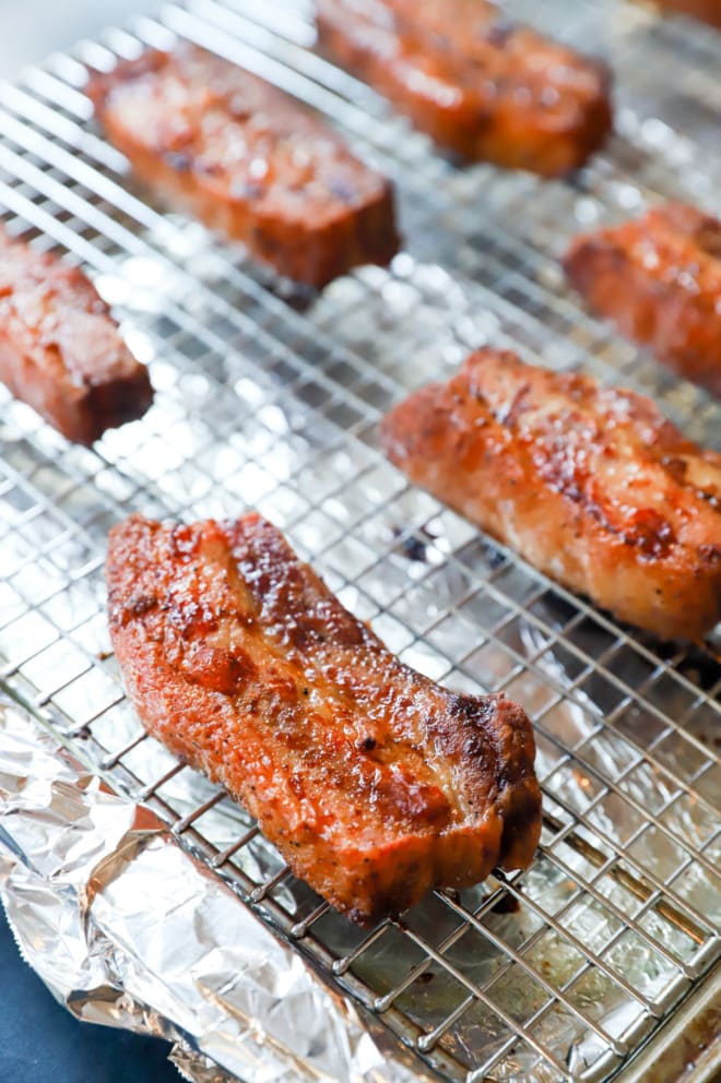 Oven roasted smokey applewood pork belly on baking rack