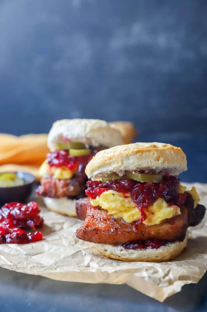 Side photo of two pork belly breakfast sandwiches