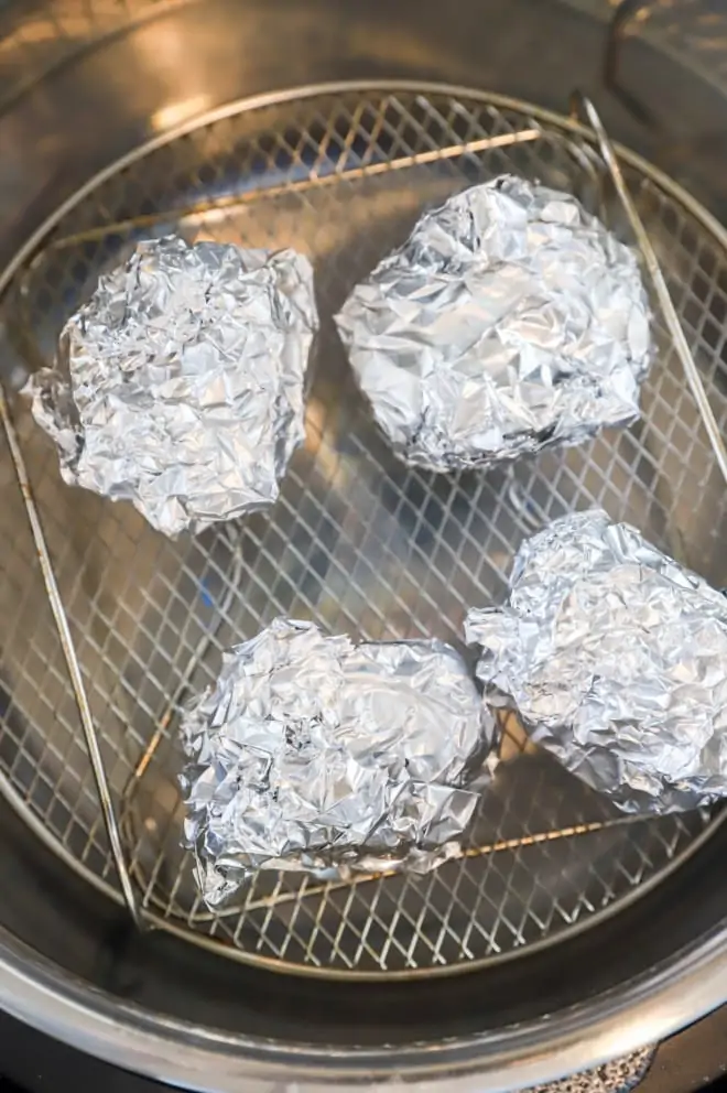 Garlic bulbs wrapped in foil in air fryer