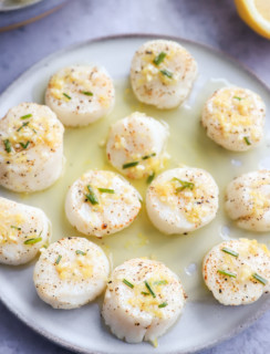Air fryer scallops on a plate with chive butter