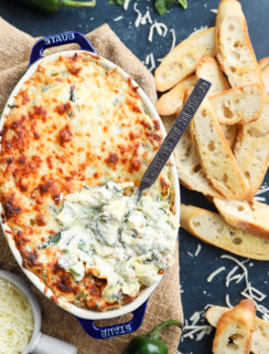 Overhead image of bacon jalapeno spinach artichoke baking dish