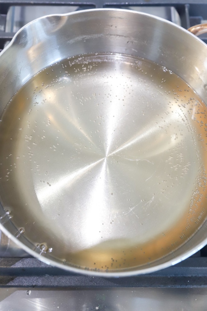 Simmering sugar syrup in a saucepan picture