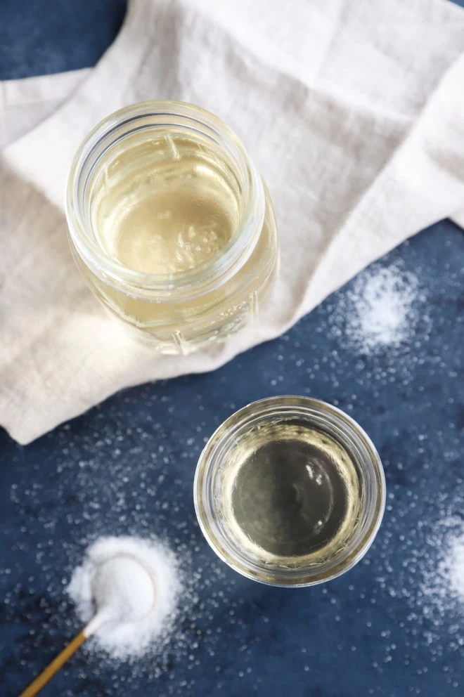 Overhead image of simple syrup in jars with sugar