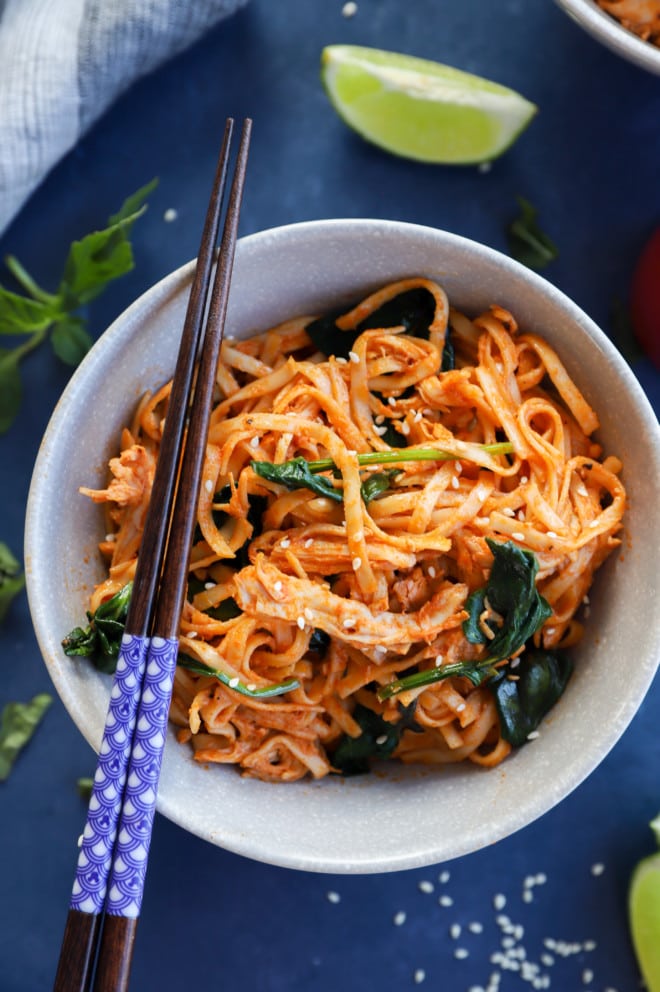 Gochujang Noodles with Chicken and Spinach in a bowl with chopsticks