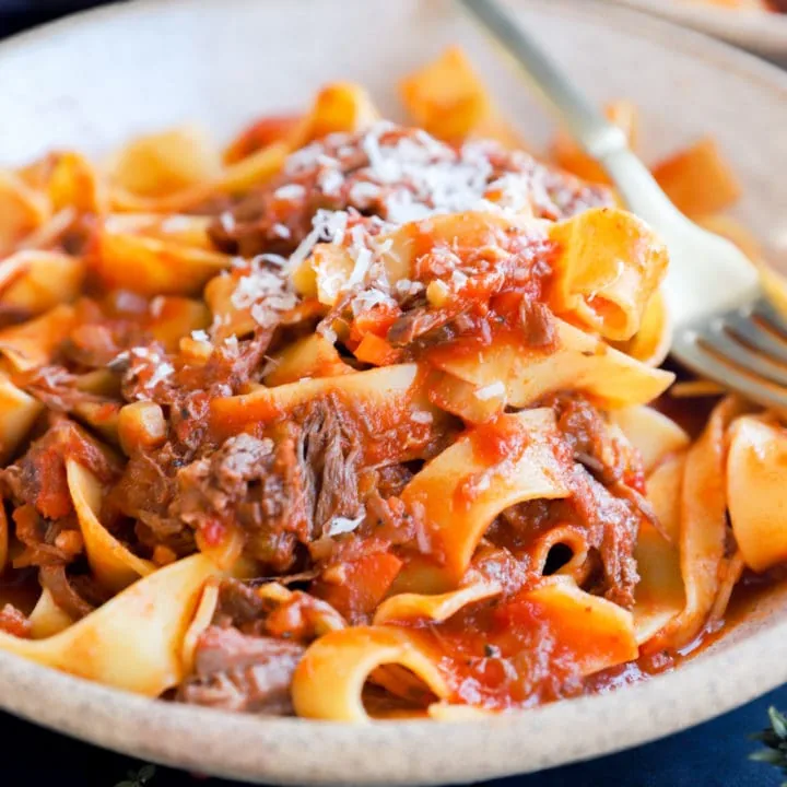 Beef short rib sauce with pasta in a bowl image