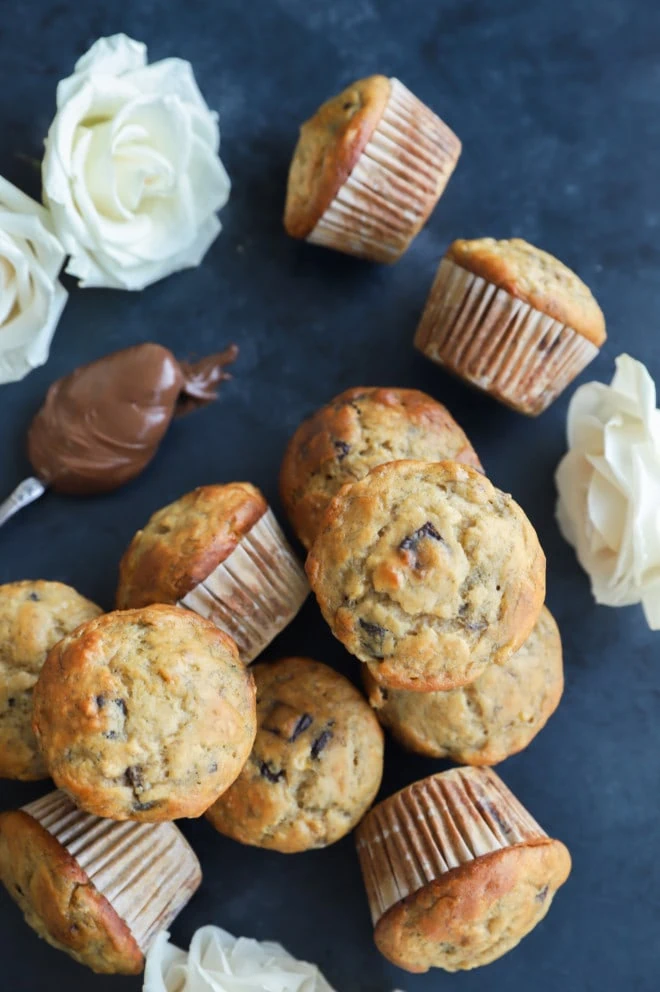 Baked breakfast goodies with flowers and chocolate hazelnut spread