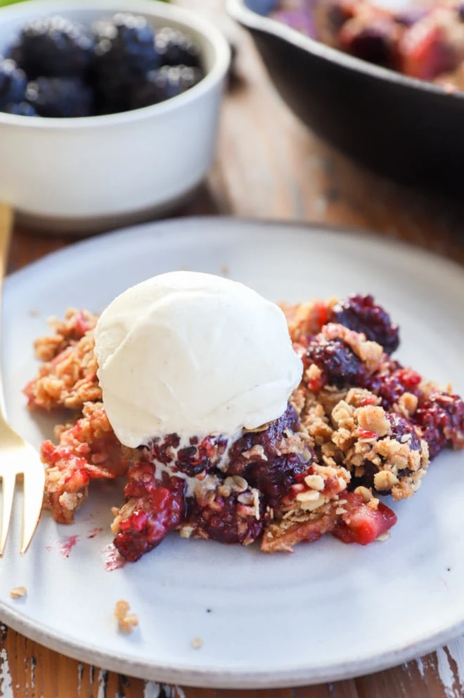 Image of berry dessert on plate with ice cream