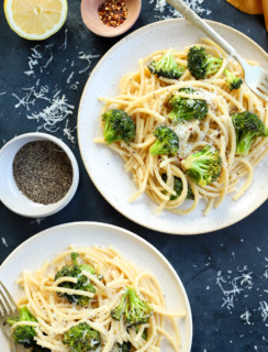 Bucatini cacio e pepe on plates with broccoli image