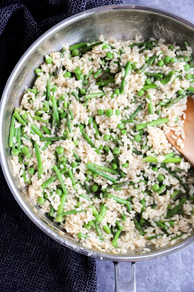 Springtime risotto in a skillet with spoon picture