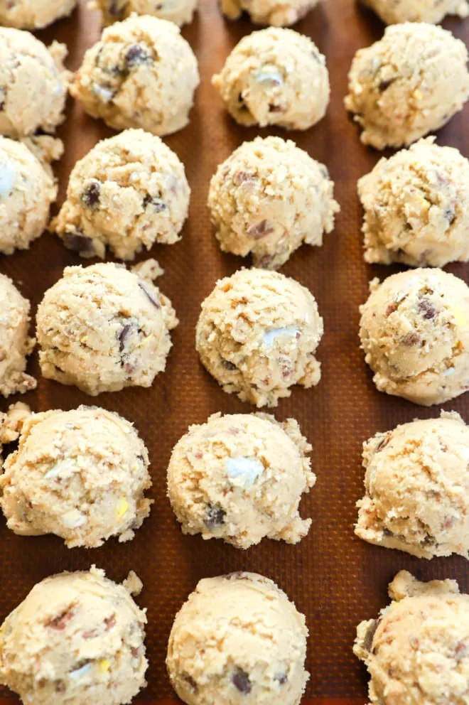 Cookie dough balls on baking sheet image