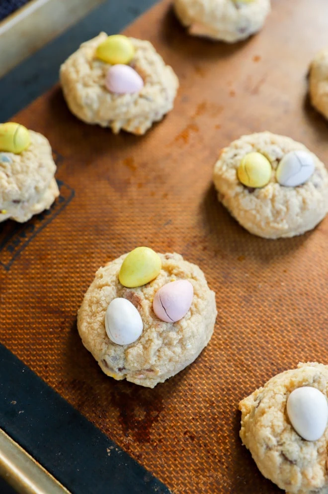 Easter egg cookies on baking sheet with silicone mat