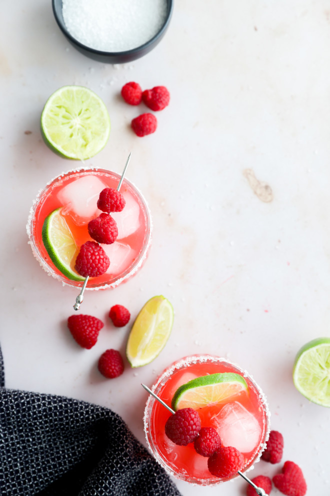 Overhead image of raspberry margaritas in glasses