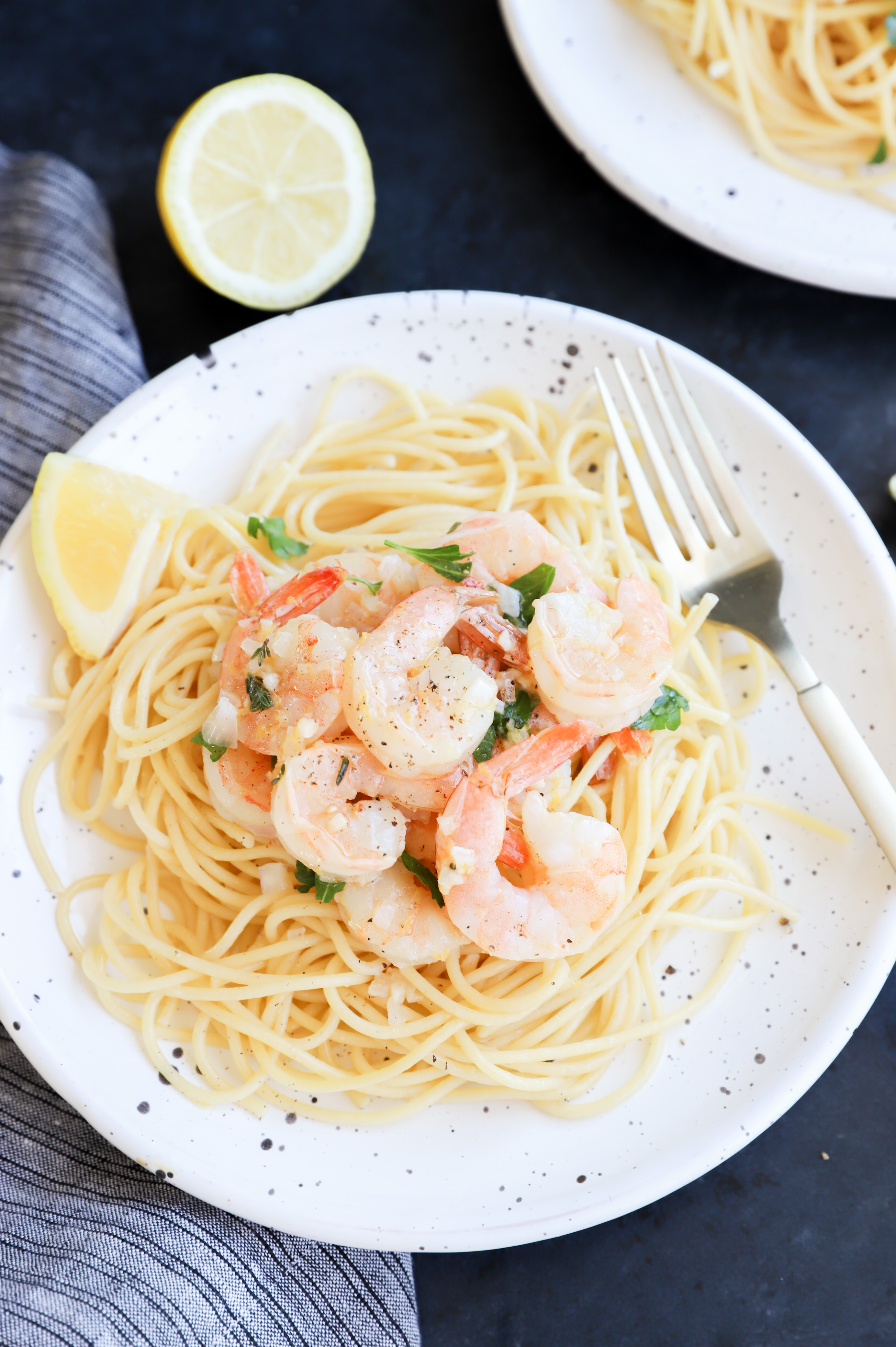Roasted shrimp served over lemon garlic pasta image