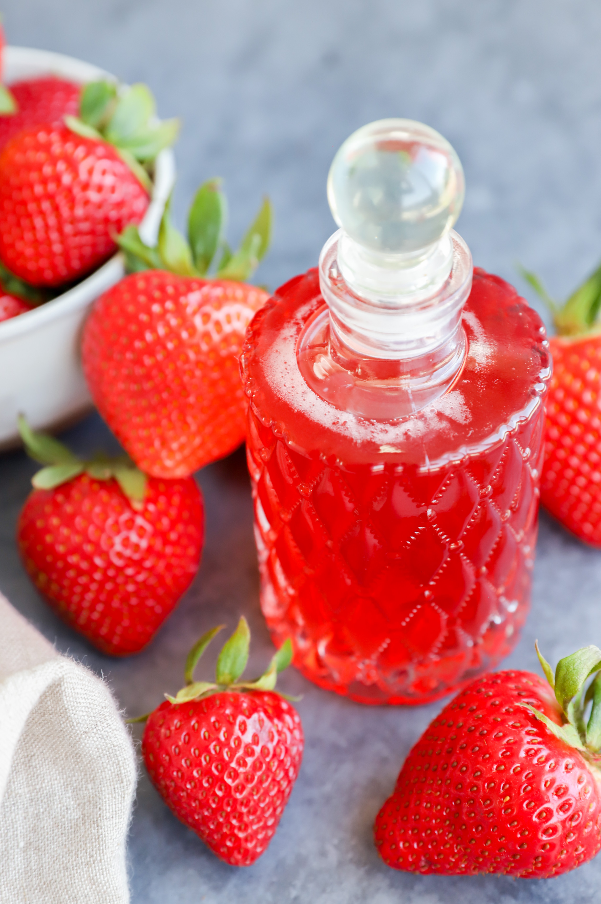 Image of strawberries and syrup in a jar with fruit