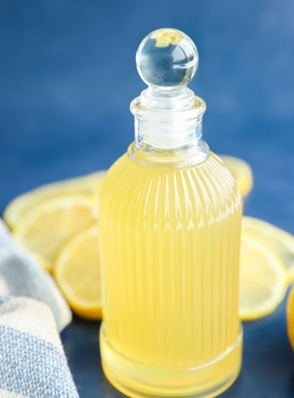 Side photo of lemon simple syrup in a jar