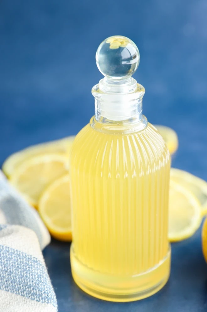 Side photo of lemon simple syrup in a jar