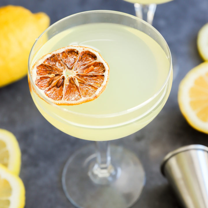 Lemon drop martini cocktails in glasses with jigger image