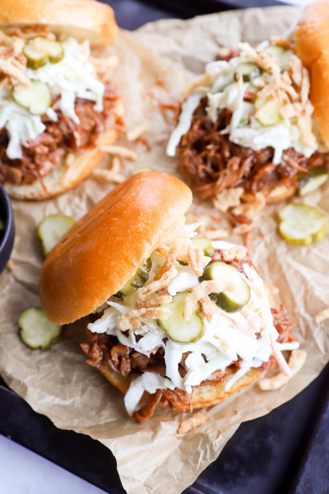 Image of pulled pork burger with parchment paper on sheet pan