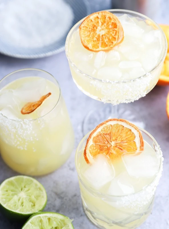 Orange slices garnishing tequila cocktails image