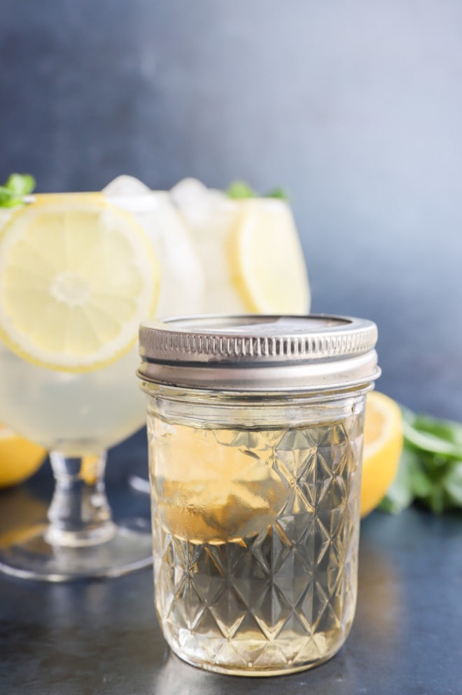 A bottle of basil infused mixture for cocktails image