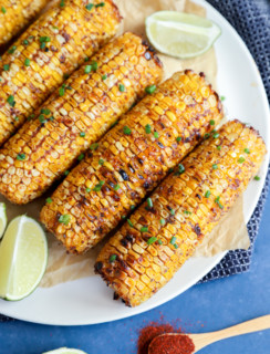 Overhead image of charred blackened corn on a plate
