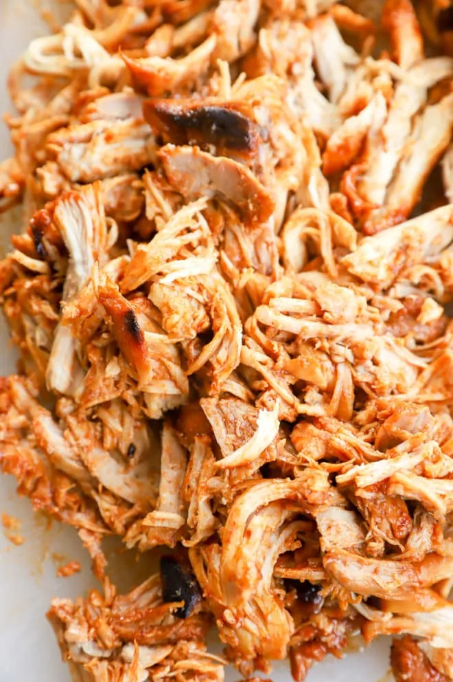 Image of pulled chicken on cutting board