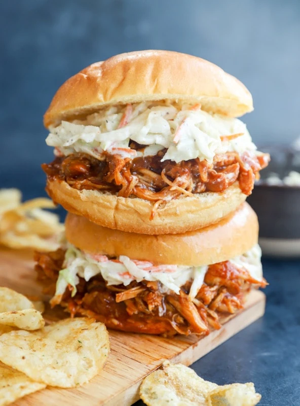 stacked bbq sandwiches with chips image