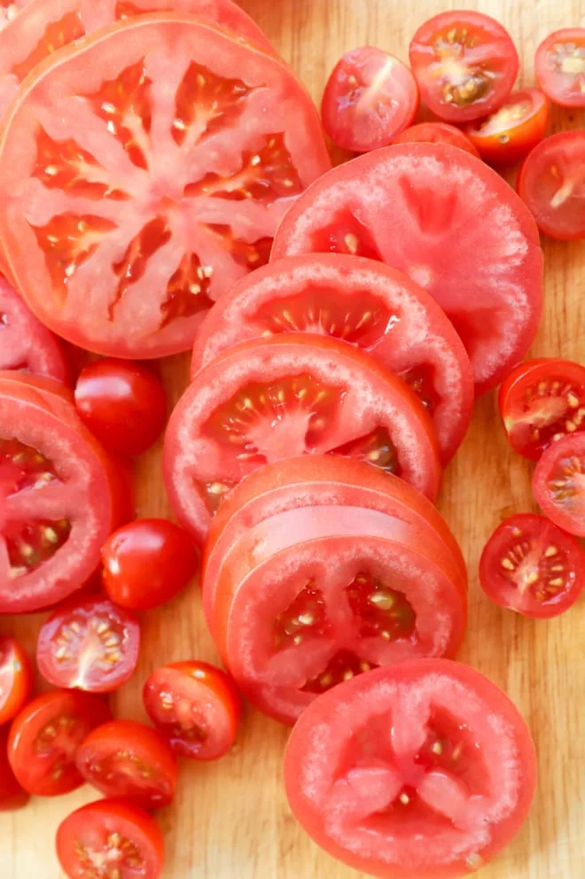 Sliced tomatoes on a cutting board picture