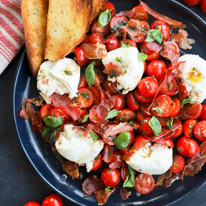 Burrata caprese salad image on platter