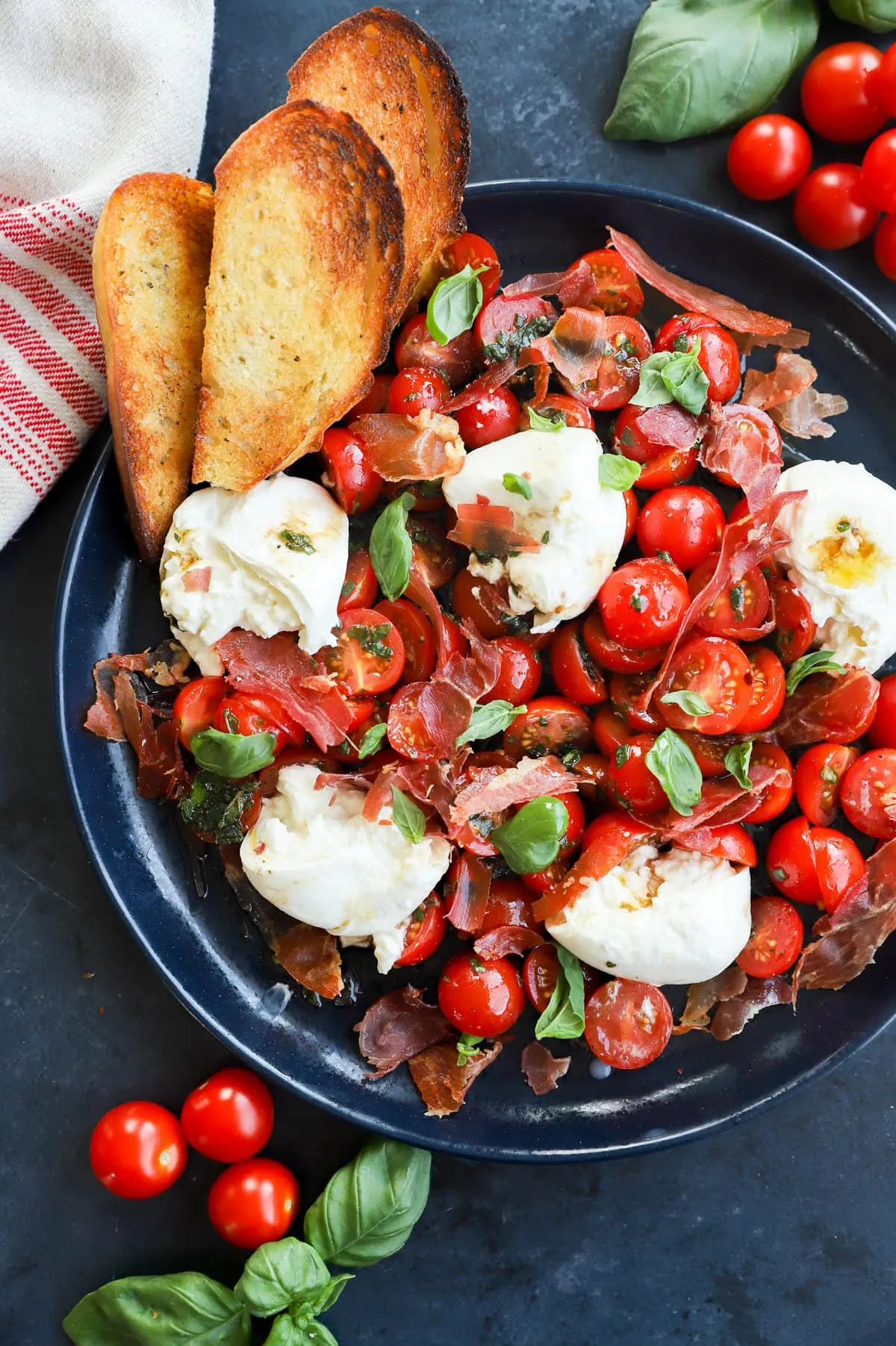 Burrata caprese salad image on platter