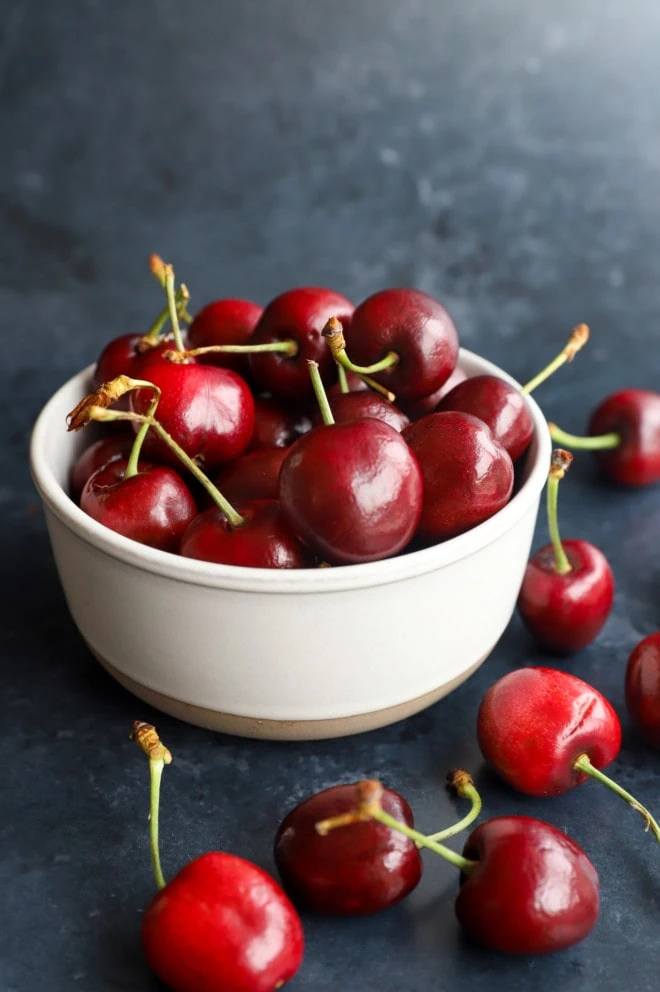 bowl of fresh summer cherries ingredients for cocktai