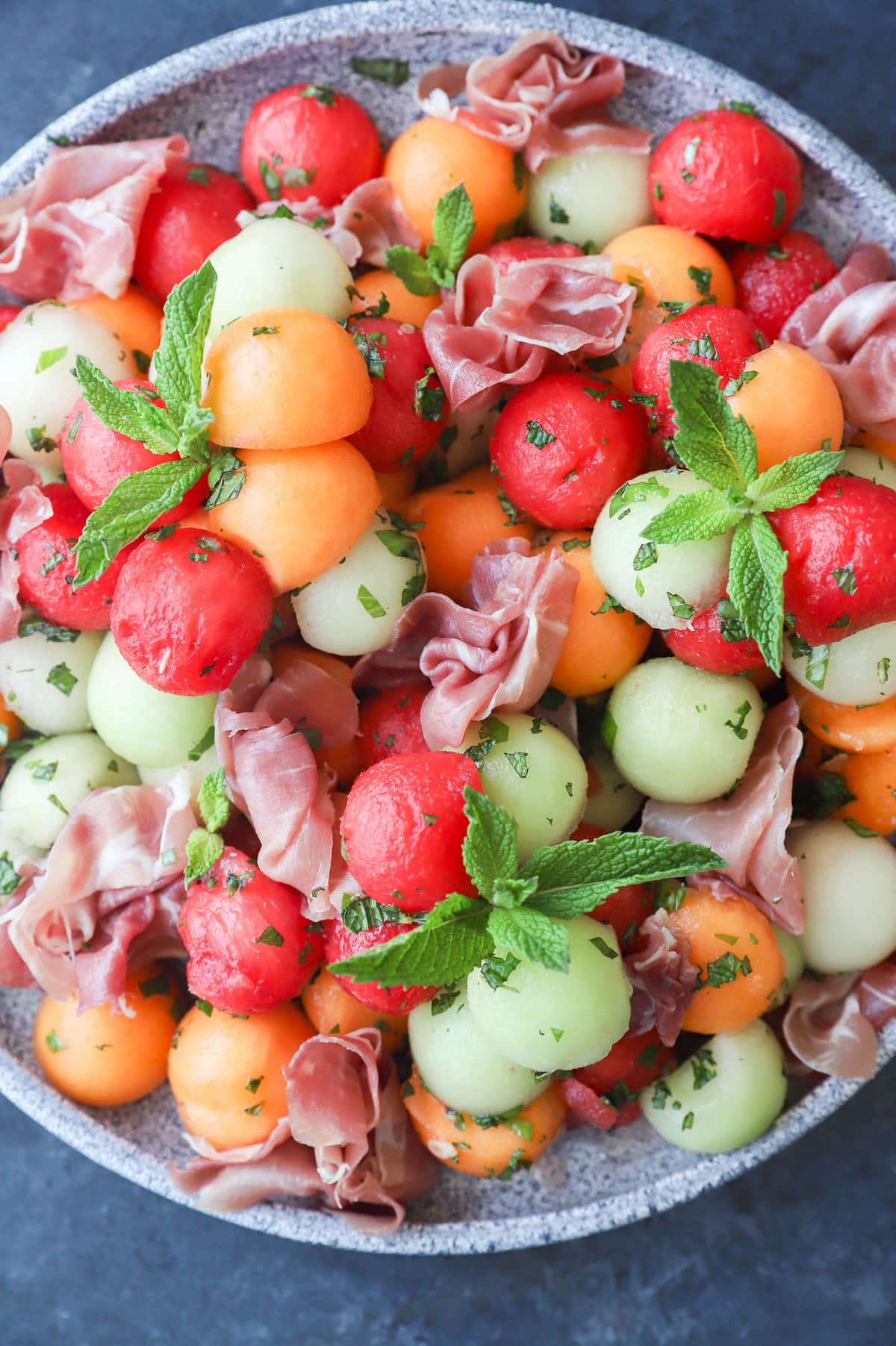 Melon prosciutto salad on platter image