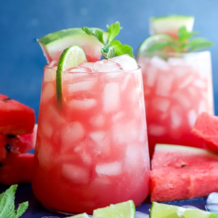 Photo of fruity cocktail in glasses with fresh fruit