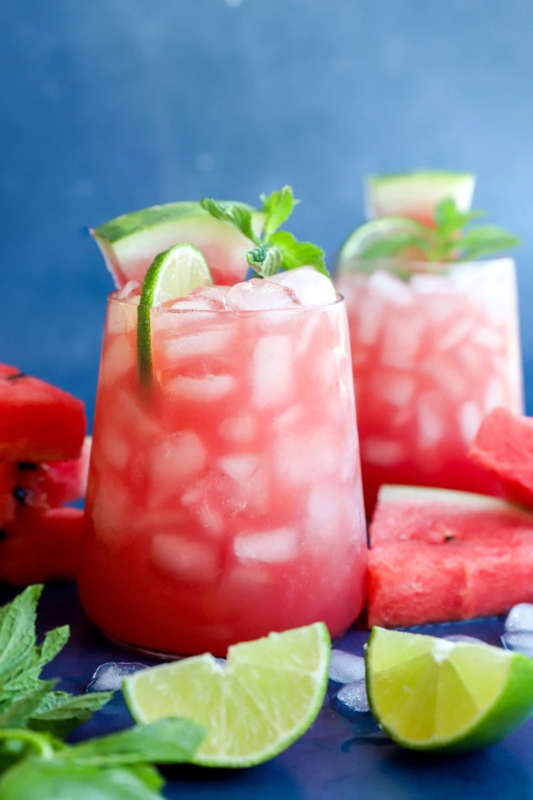 Photo of fruity cocktail in glasses with fresh fruit