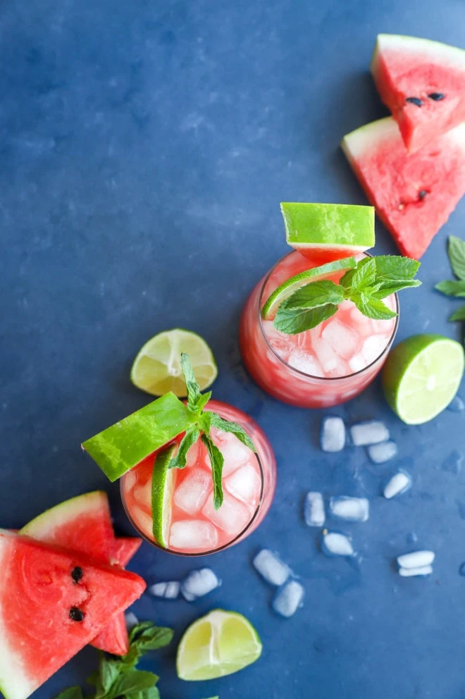 Overhead image of summer drinks in glasses with garnish