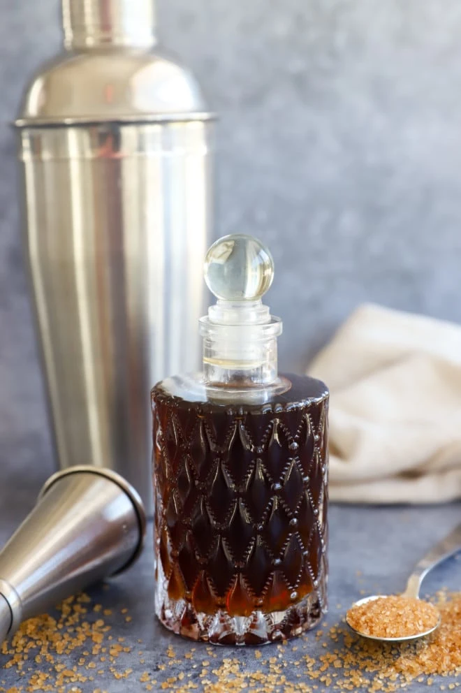 Sweetener in a bottle with cocktail tools