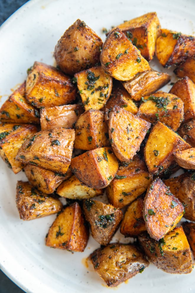 Freshly fried potatoes on a plate image