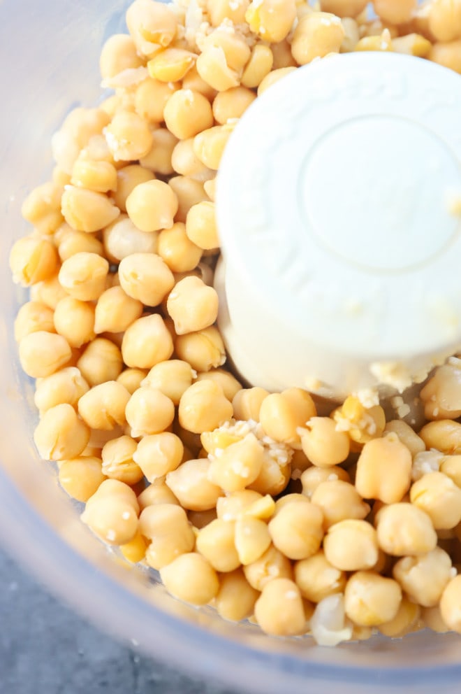 Chickpeas and garlic in a food processor