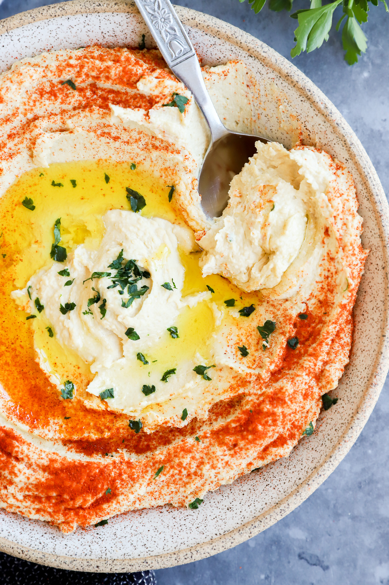 Scooping out a creamy chickpea dip