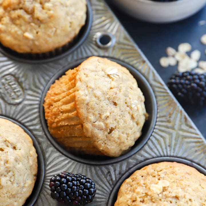 honey oatmeal blackberry muffins in baking pan