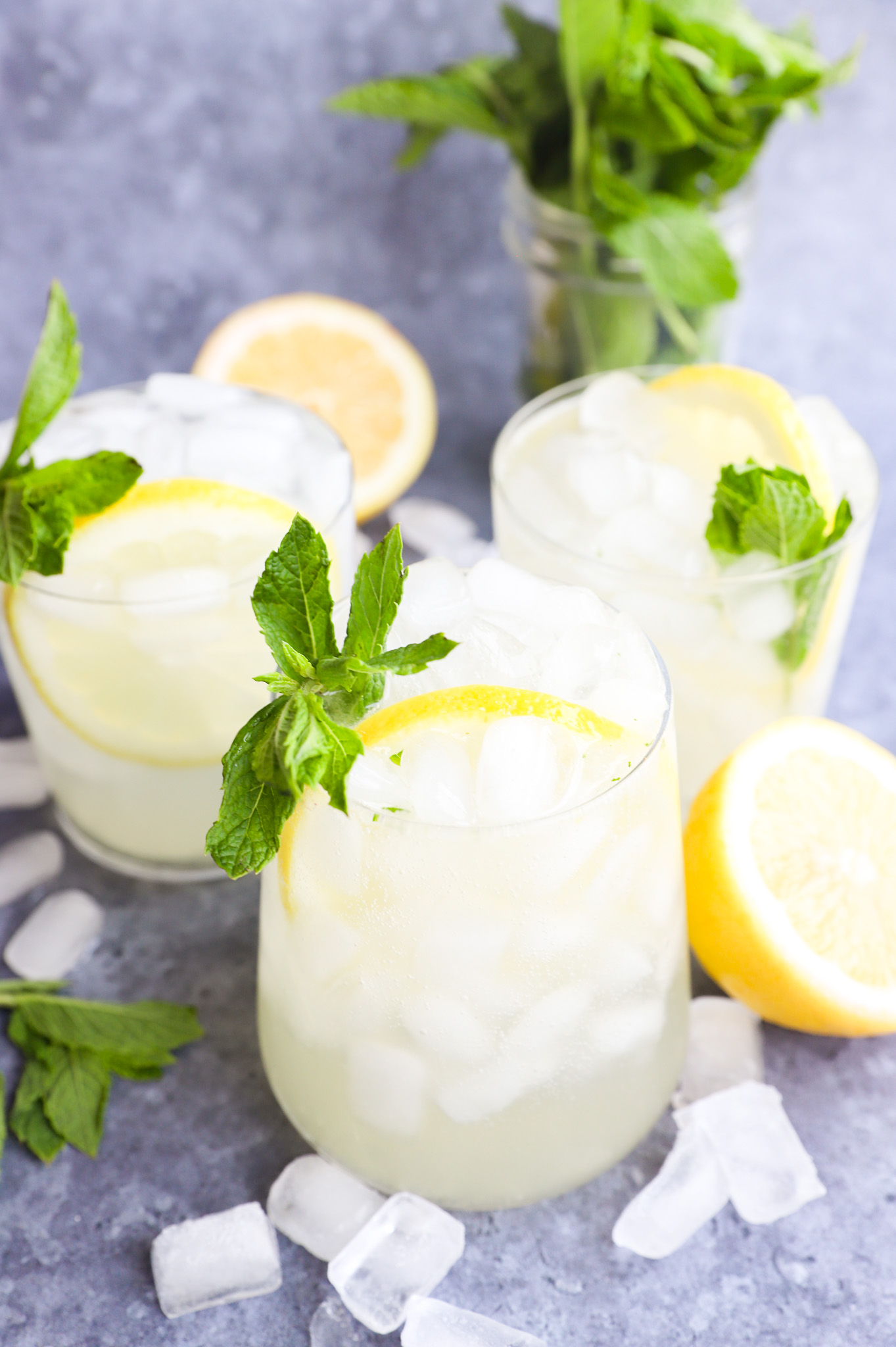 Citrus cocktails with mint in cocktail glasses photo