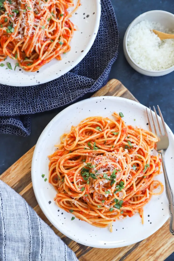 Italian spaghetti with tomato sauce and basil on a plate