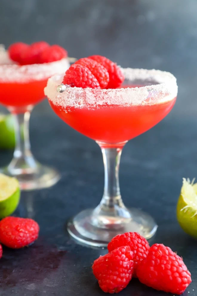 raspberry daiquiri in coupe glass with sugar rim